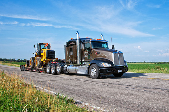 semi truck driving down a Kansas highway